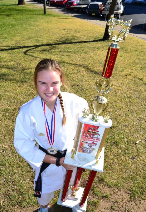 SENSATIONAL: Kiara Blattman with her trophy from the US Open ISKA World Martial Arts Championships. Blattman was victorious in kata. Photo: ALEXANDER GRANT