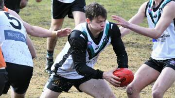 COMING THROUGH: Bathurst Bushrangers' Tom Maher looks for space in Saturday's derby. Photo: CHRIS SEABROOK