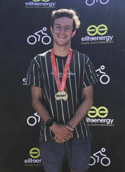 GOLD MEDAL: Jack Reen all smiles after completing his first half Ironman at the Husky Triathlon Festival.