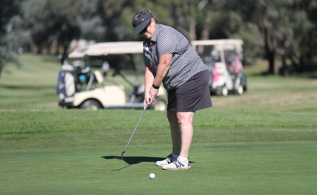 HOPING FOR THE BEST: Mary Housler watches her putt during the Bathurst Ladies Golf Open. Photo: PHIL BLATCH