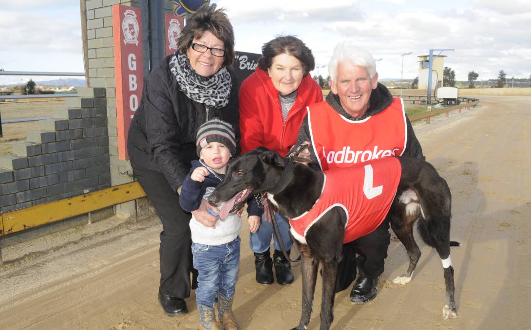 ALL SMILES: Lynn Maney (trainer), Sue Thorncraft (owner), Michael Maney (trainer). Front, Conor Erwich (Thorncroft's grandson) with Legend Man. Photo: CHRIS SEABROOK