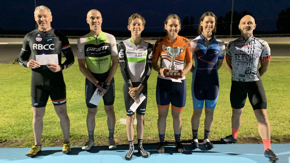 SPRINTING PROWESS: Kalinda Robinson holds the winner's trophy alongside the rest of the top six finishers. Photo: CONTRIBUTED