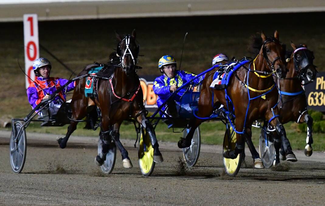 MAJOR EFFORT: Anthony Frisby drives Major Occasion to victory ahead of Callmequeenbee. Photo: ALEXANDER GRANT