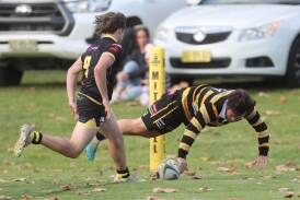 Patrick Clark scores a try for CSU in their game against Dubbo Rhinos. Picture by Phil Blatch