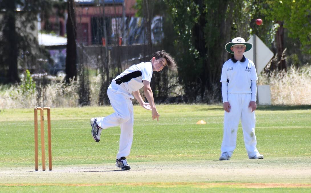 TITLE: Bathurst's Riley Hoad was one of six different wicket takers for Mitchell in their tied game with hosts Macquarie on Sunday. Mitchell finished the season as unbeaten premiers after winning their three matches coming into the deciding contest. Both Mitchell and Macquarie ended their innings on 156 runs. Photo: AMY MCINTYRE