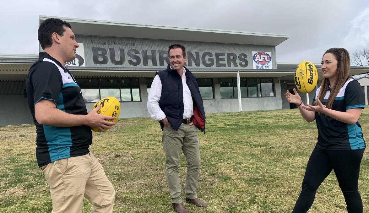 TIME FOR AN UPGRADE: Bathurst MP Paul Toole, centre, with Bathurst Bushrangers players Alex Sparks and Tori Whitla. The Bushrangers will be adding a seating area for spectators near their clubhouse.
