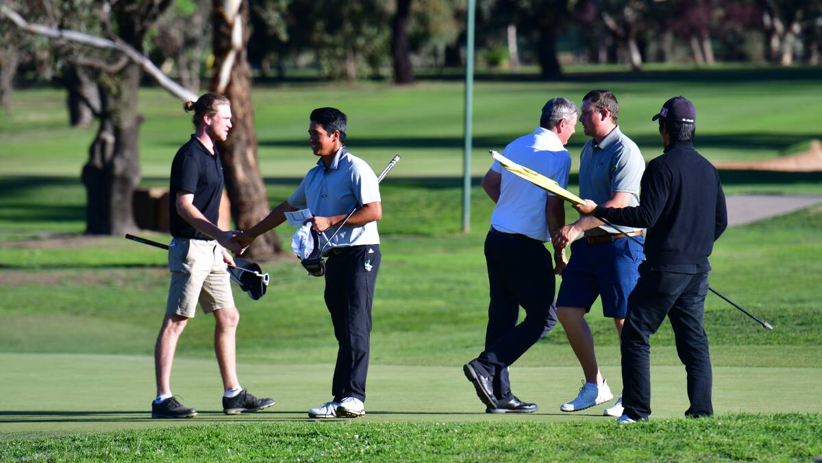 EIGHT UNDER: James Conran (left) shakes hands with his competitors following the second round at the Bathurst Open. Photo: ALEXANDER GRANT