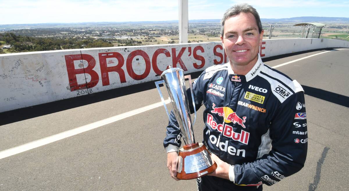 BATHURST BOUND: Craig Lowndes stands atop a sunny Skyline with the Peter Brock Trophy on Wednesday. Photo: CHRIS SEABROOK