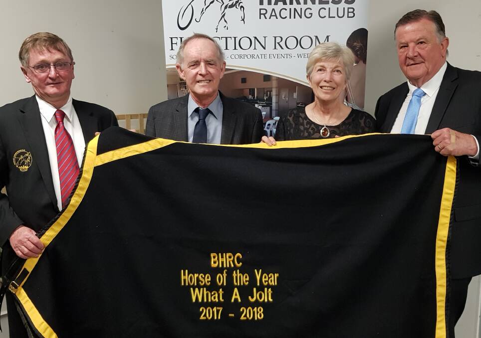 TOP AWARD: Lester and Linda Hewitt (centre) are presented What A Jolt's Horse of the Year prize.