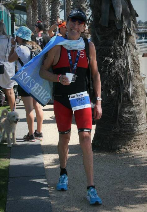 WELL EARNED DRINK: Mark Windsor cools down following his age category victory at the Geelong 70.3 Ironman Championship. Photo: CONTRIBUTED