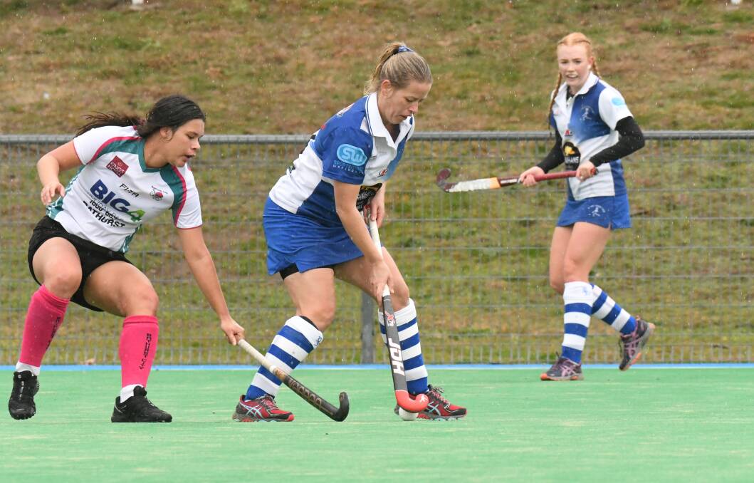 BLUE AND WHITE DAY: Lucy Weal and St Pat's are flying high after their 4-1 derby win against Bathurst City during Orange's gala for Premier League Hockey. Photo: CARLA FREEDMAN