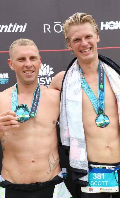 CHUFFED: Chris Howarth and Scott Mclennan stand proud with their medals following the Western Sydney Ironman 70.3 on Sunday. Photo: CONTRIBUTED