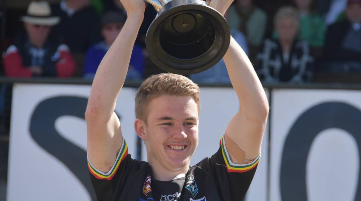 ONE STEP CLOSER: Noah Griffiths lifts the trophy after last year's grand final. Can Panthers do the same in 2019? Photo: PETER GUTHRIE