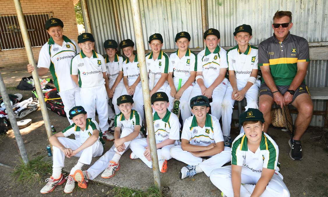 WINNERS: Bathurst's under 12s side prepare to go out and field during Sunday's final against Orange at Brooke Moore Oval. Photo: CHRIS SEABROOK