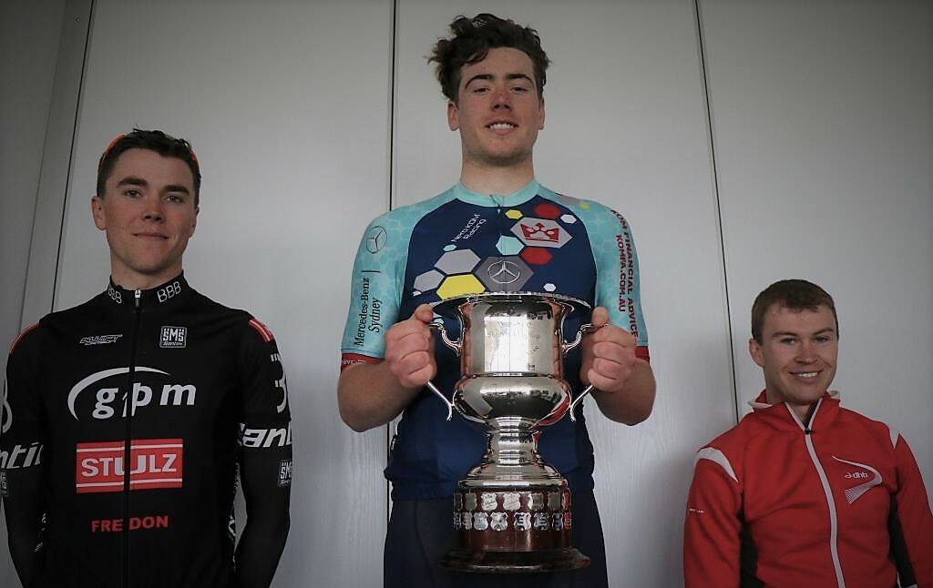BIG EFFORT: Harry Bryant holds the Rockley Cup after winning the race from the 14 minute starting mark. Scratch rider Will Hodges (left) was second while 30:30 minute starter Chris Davis was third. Photo: CONTRIBUTED