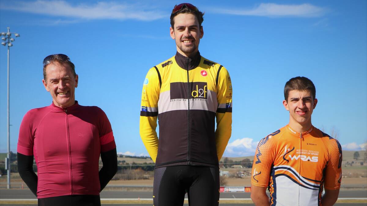 WINNER: Brad Rayner stands atop the Bathurst Road Cycling Championship A grade podium after beating Mark Windsor and Daniel Googe.