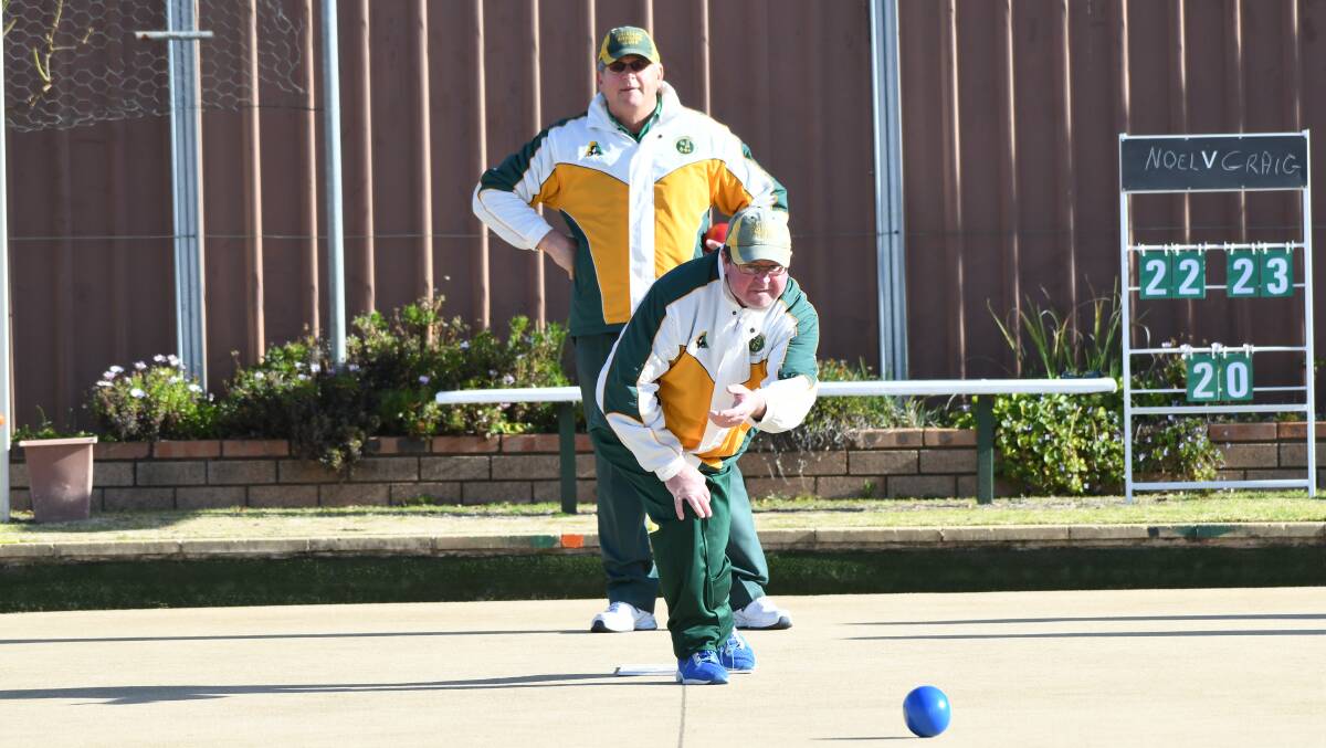 CLUB BATTLE: Majellan Bowling Club's Mens A grade semi-final unfolds on Saturday. Craig Bush sends one down as Noel Witney watches on. Bush made a successful comeback to reach the final. Photo: CHRIS SEABROOK 070420cbowls1a