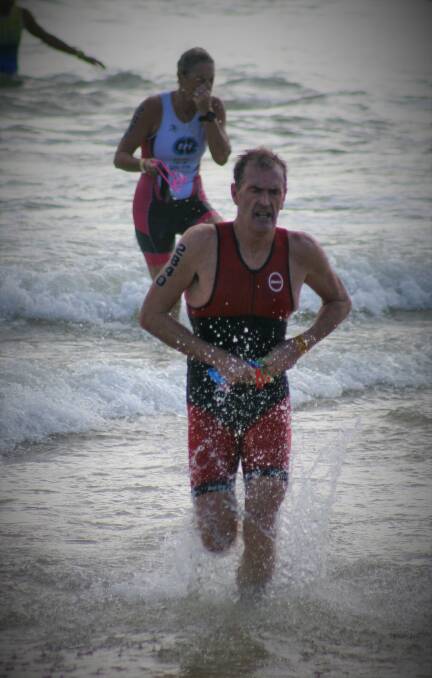 THIRD VICTORY: Mark Windsor emerges from the swim leg on his way towards a win at Mooloolaba last Sunday. Photo: CONTRIBUTED