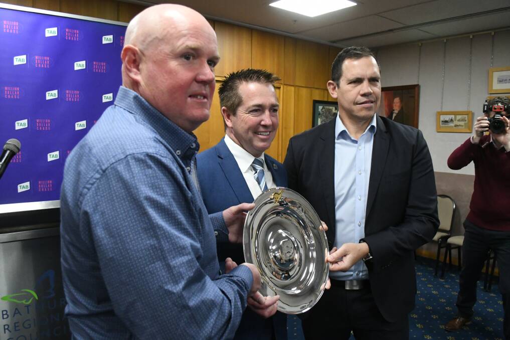 DRAWING NEAR: Kennerson Park racing manager Jason Lyne, local member Paul Toole and Greyhound Racing NSW CEO Tony Mestrov. Photo: CHRIS SEABROOK