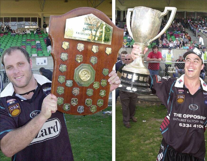 FLASHBACK: Panthers premier league player-coach Dave Elvy and first division captain Aaron Bateup celebrate their titles at Carrington Park in 2007. Panthers have a chance to repeat those efforts this Sunday. Photos: CHRIS SEABROOK