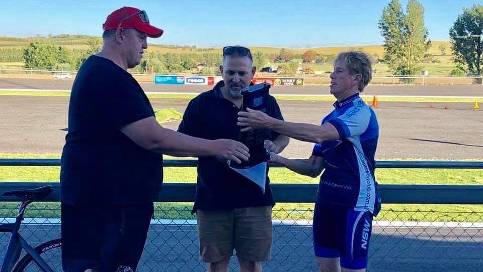 AWARD: Glenn Allen (left) is presented the Dave Carroll Memorial Trophy for his services for the Bathurst Cycling Club in 2018. Photo: CONTRIBUTED
