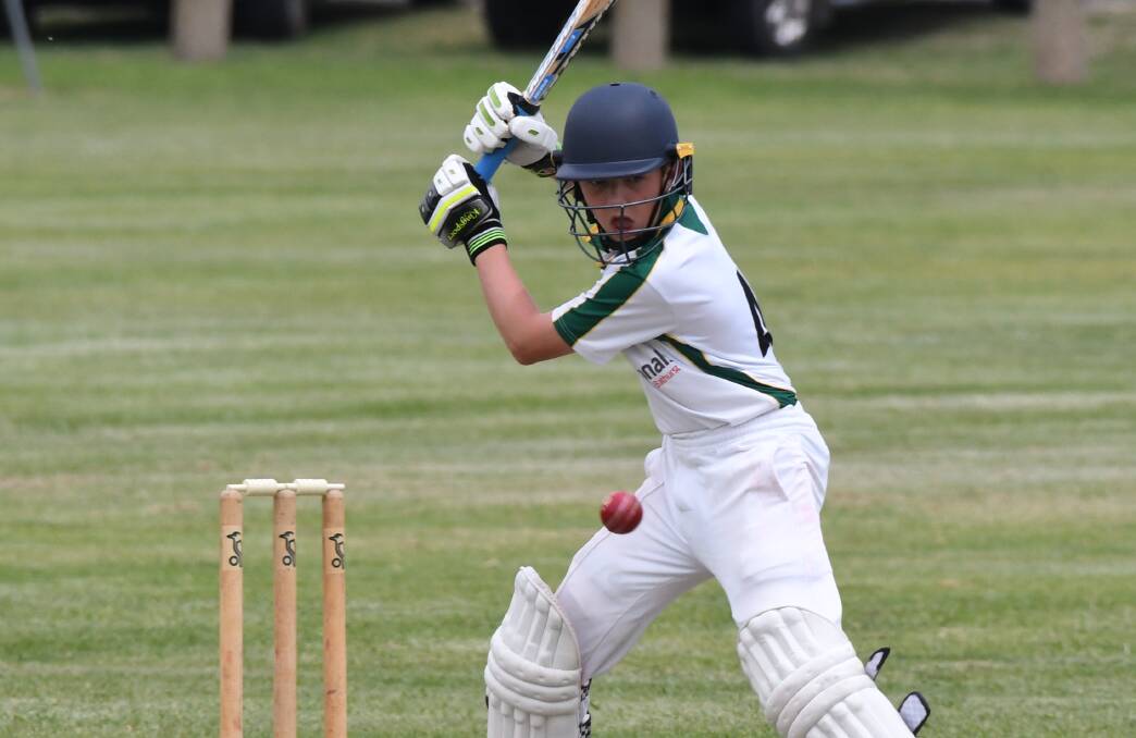 EYES ON THE PRIZE: Angus Parsons lines up a shot for the Bathurst under 14s side in their match against Orange on Sunday. Bathurst's under 14s and 12s enjoyed victories over the same opponents on home turf. Photo: CHRIS SEABROOK