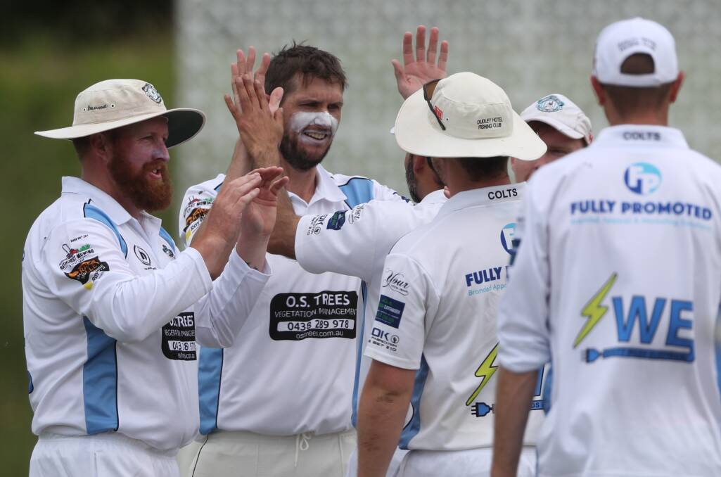 FIVE WICKETS: City Colts' Nick Babcock (centre) celebrates a dismissal during Saturday's game against Centrals. Photo: PHIL BLATCH