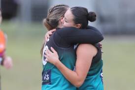 Angela Evans and Callee Black celebrate a goal during the Bushrangers' win over the Giants. Picture by Phil Blatch.