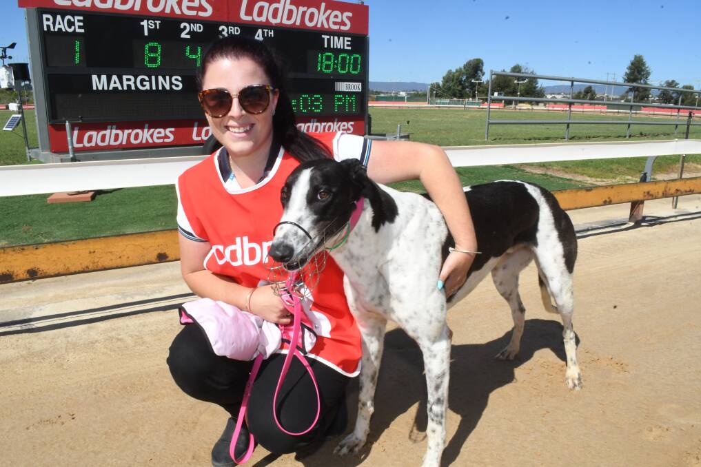 BIG LAD: Caitlyn Brewer with Recognize, winner of the opening race at Kennerson Park. Recognize beat home nearest rivals Miss Vanuatu by two and a half lengths in his debut run. Photo: CHRIS SEABROOK 120318cdogs1