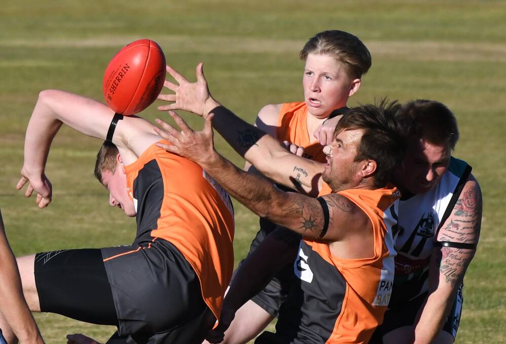 JUST OUT OF REACH: Bathurst Giants' Paul Jekins has the ball in his sights. Photo: CHRIS SEABROOK