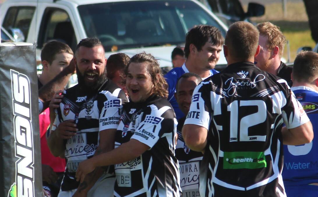 ONE POINT IN IT: Jeremy Gordon and Joey Bugg celebrate a Cowra Magpies try during their game against St Pat's. Gordon's field goal would take Magpies to a 21-20 win at home. Photo: PETER GUTHRIE