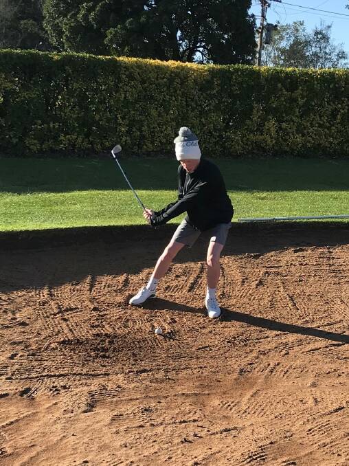 ON THE RISE: Cameron Jackson prepares to hit his ball out of the bunker during his round of pennants at Duntryleague. Photo: BATHURST GOLF CLUB
