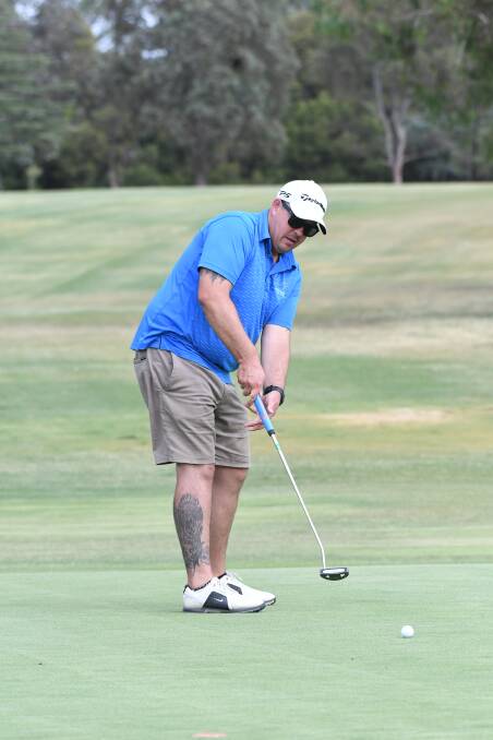 LEFTY: Andrew Hanger makes a putt during a recent round of Saturday golf. Photo: CHRIS SEABROOK 010519cgolf4