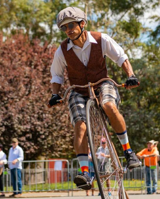 HIGH-RISE PEDAL POWER: Laurence Outim takes on the main course during the recent Penny Farthing Nationals in Tasmania. Photo: STEVE WHITWORTH