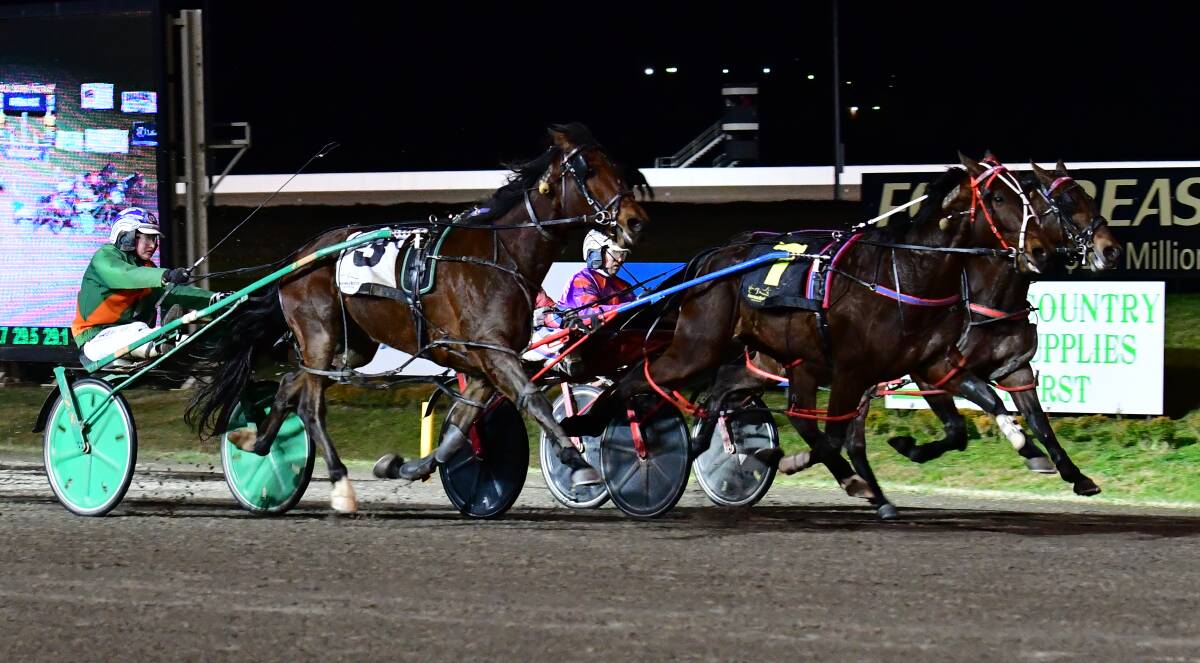 THREE-HORSE FINISH: Major Bracken (seven) did just enough to hold out Standandeliver (left) and Infinity Beach (right) in Wednesday night's racing at Bathurst Paceway. Photo: ALEXANDER GRANT