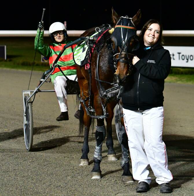 UPSET VICTORY: Travis Bullock and Kim Grant celebrate Wednesday night's TAB Regional Championships Western Heat win with Enk Spot Shannon. Photo: ALEXANDER GRANT
