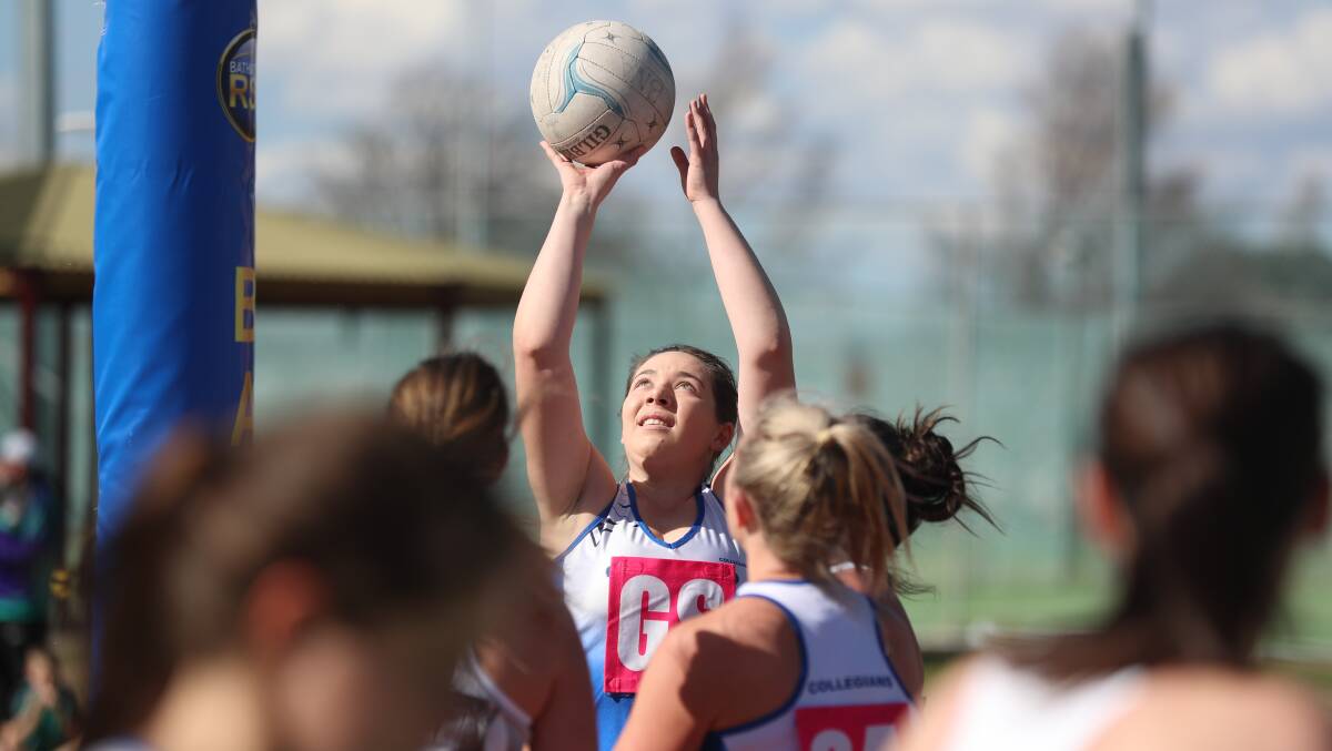 READY TO FIRE: Caitlyn Matthews lines up a shot for Collegians in their Bathurst District Netball game against Mana on Saturday. Photo: PHIL BLATCH