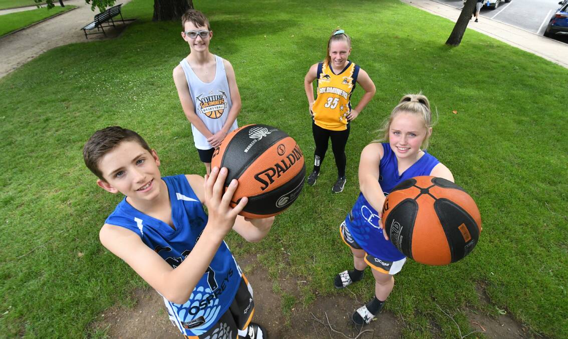 LET'S PLAY: Bathurst's D-League representatives Riley and Roxy George (front) plus Jett Chaniotis and Zara Phillips will be in action this season. Photo: CHRIS SEABROOK