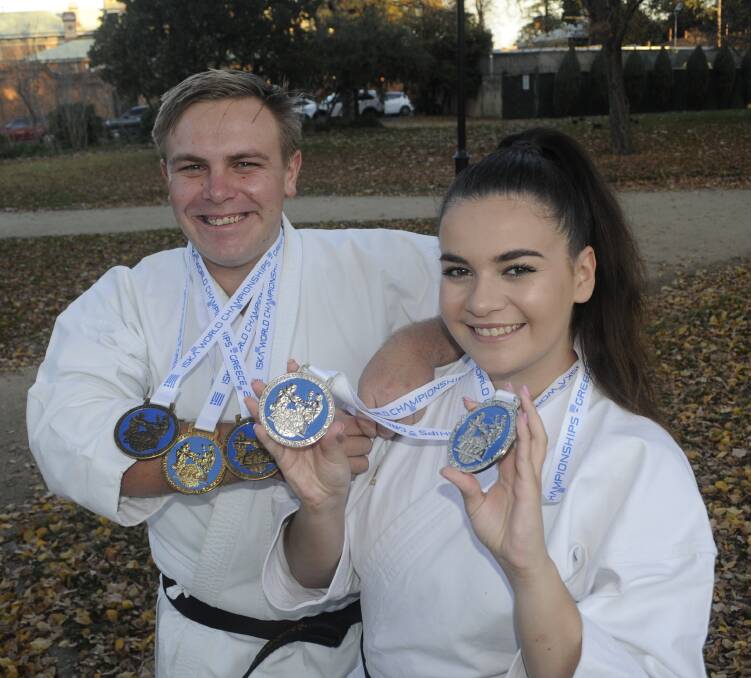 GREEK DELIGHT: Dale Thornberry and Brittany Reece have returned from the International Sports Kickboxing Association World Titles with five medals between them. Photo: CHRIS SEABROOK 061317ciska1