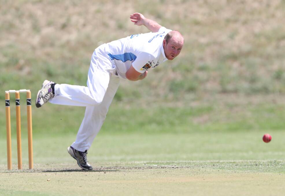 FOUR WICKETS: Angus Daymond sends down a delivery during a productive day for City Colts. Photo: PHIL BLATCH