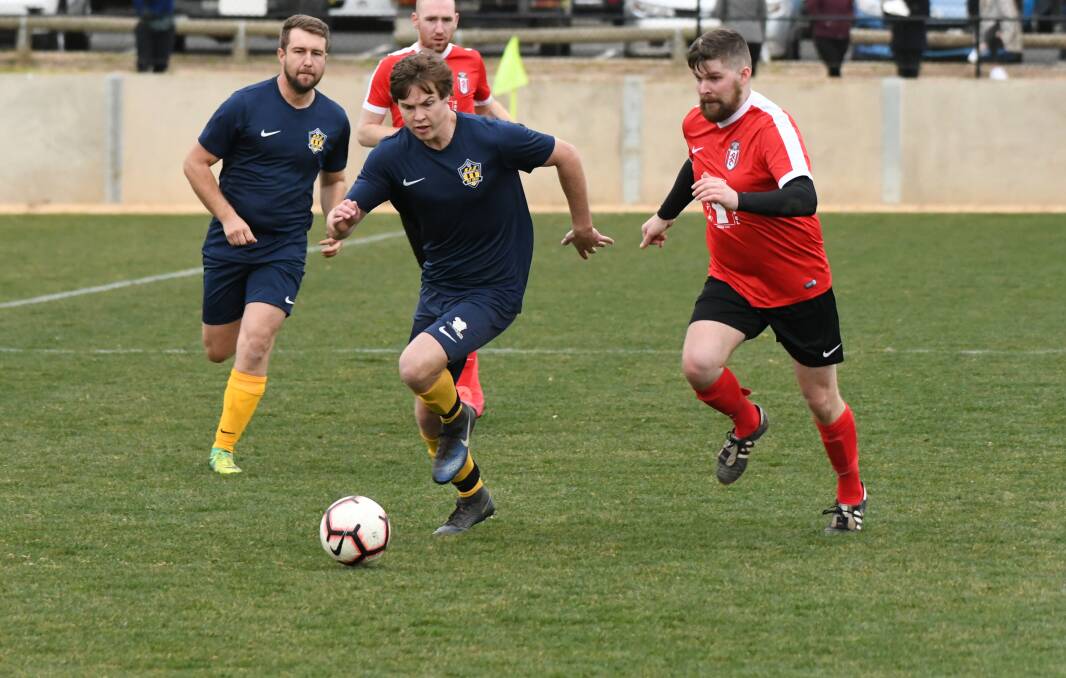 ON TOP: James Baker and Abercrombie FC Navy are guaranteed first place on the ladder with a round to play. Photo: CHRIS SEABROOK