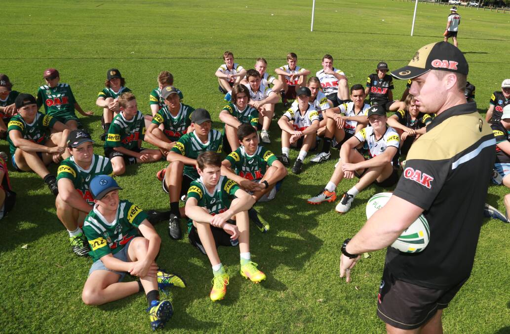 ATTENTION: Penrith Panthers SG Ball coach Ben Harden talks to players during Tuesday's clinic at Morse Park. Photo: PHIL BLATCH