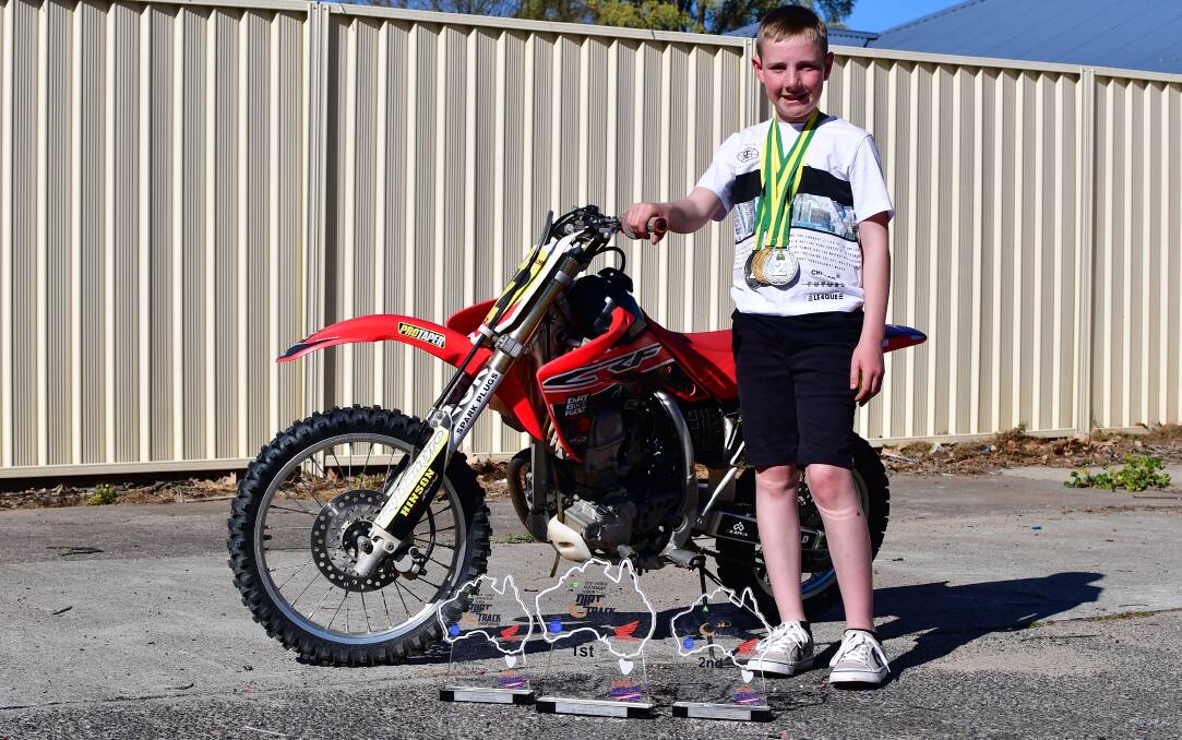 MEDALS: Noah Grabham with his Australian Junior Dirt Track Championships prizes. Photo: ALEXANDER GRANT