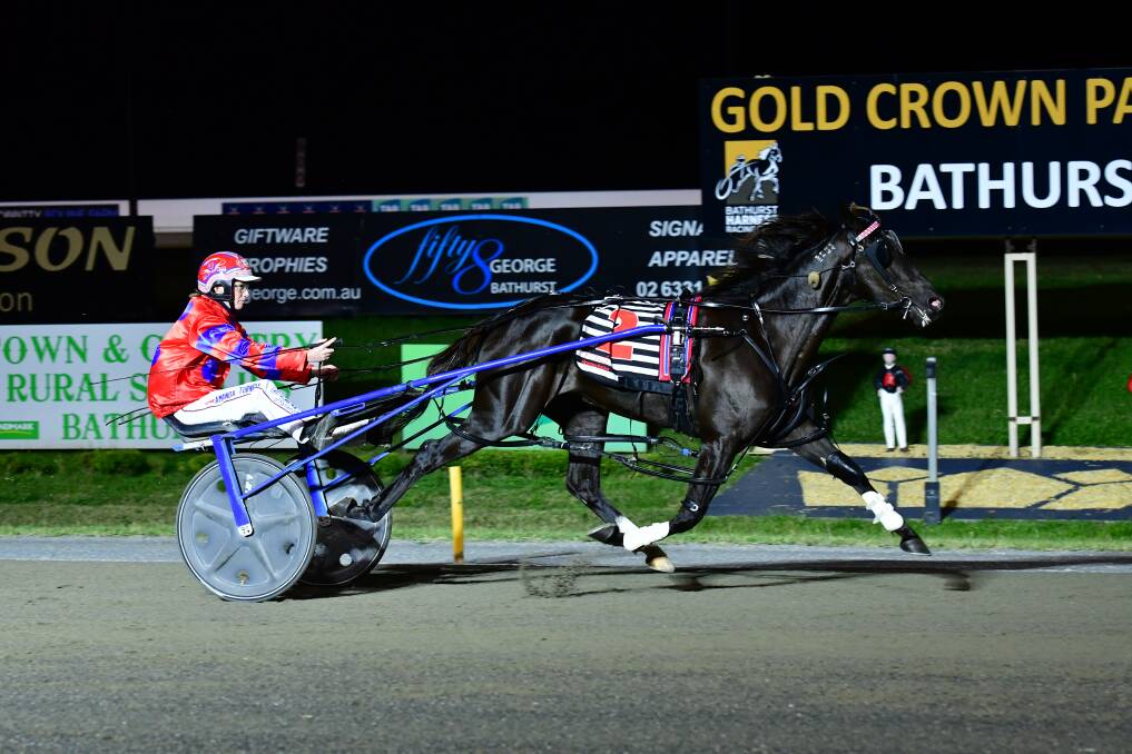 EASY MODE: Oliveira cruises to victory in the Bathurst Gold Tiara Silver Consolation on Wednesday night. Turnbull claimed the silver double with her colt Firefly also claiming victory. Photo: ALEXANDER GRANT
