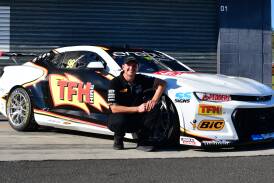 Todd Hazelwood with his Erebus Motorsport Camaro at Thursday's livery unveiling. Picture by Alexander Grant.