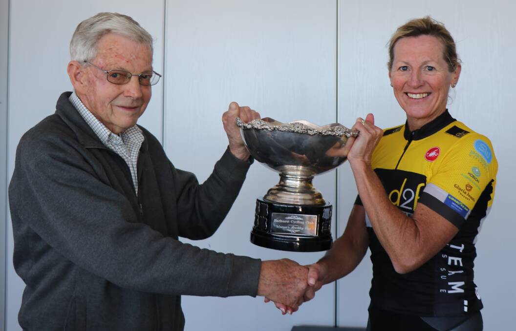 CHAMPIONS: Jodie Martin is presented the first female rider award by 1969 cup winner Geoff Rice.