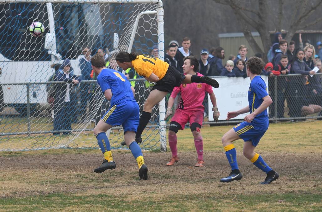 UNFORTUNATE: The only goal of the boys soccer came via this Orange own goal. Photo: ALEXANDER GRANT