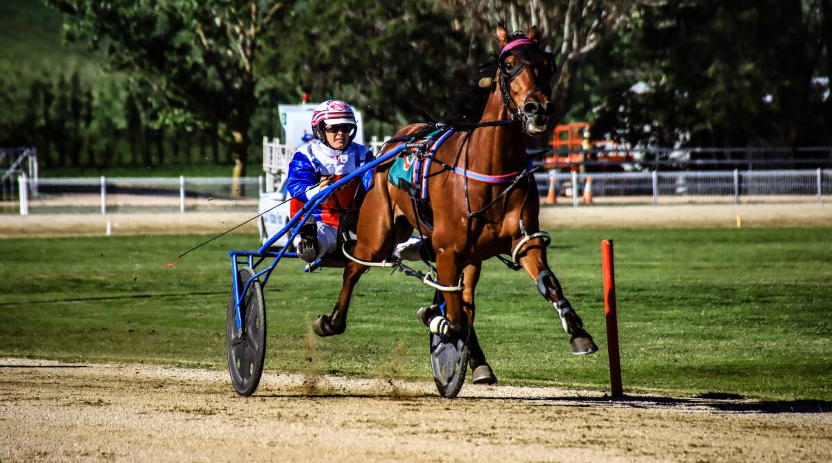 TREBLE: Isobel Ross steers the first of her three winners on Sunday, Chasing The Wind, to the finish line at Blayney. Photo: COFFEE PHOTOGRAPHY