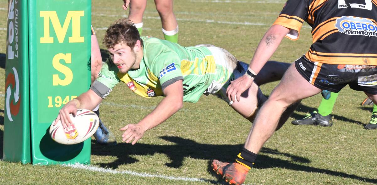STARRING ROLE: Ryan Griffin dives over for the first of his two second-half tries in Sunday's easy win over Oberon. Photo: CARLA FREEDMAN