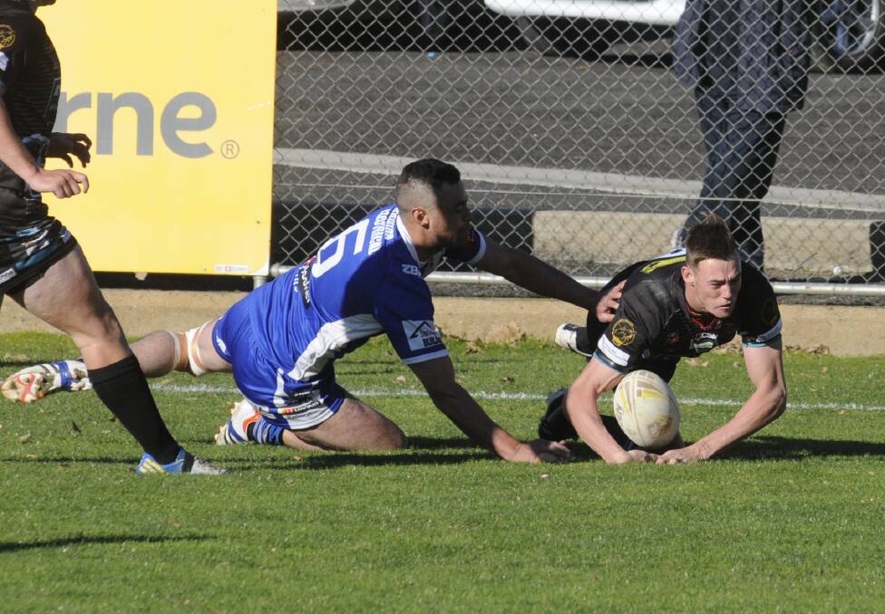 TRY TIME: Bradyn Cassidy goes over for Bathurst Panthers in their 20-14 premier league win on Sunday over St Pat's. Photo: CHRIS SEABROOK 070316cpan11
